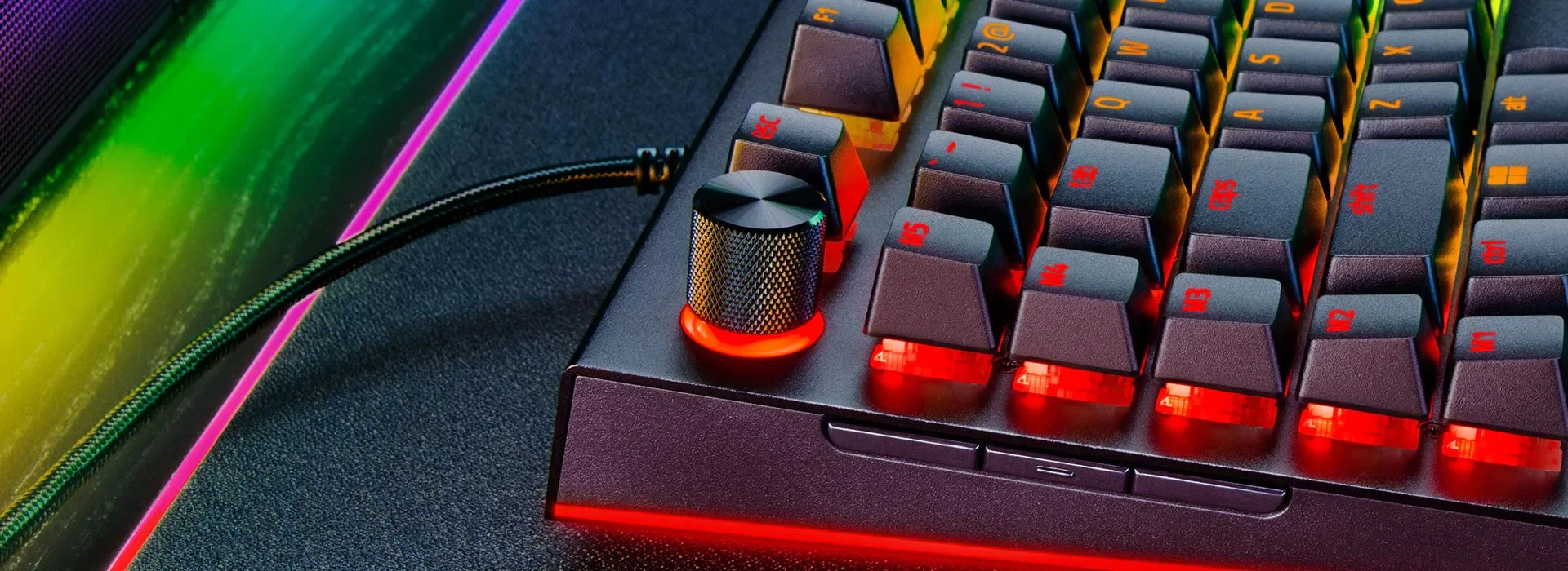 Split image showing a wired keyboard connection on one side and a wireless dongle connection on the other.