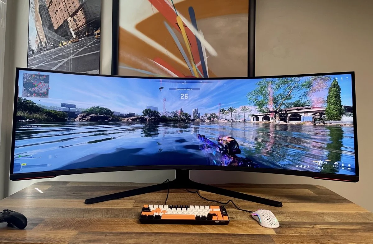 The Gigabyte M28U sitting on a desk with a vibrant 4K game displayed on the screen.